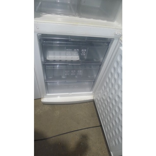 1115 - A tall fridge freezer by Bosch missing one handle - requires attention 240v trade