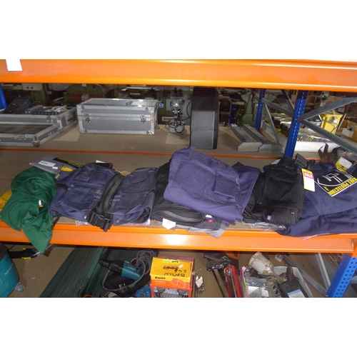 228 - A quantity of various work clothing by Snickers, Dewalt, Site etc comprising mainly trousers and shi... 