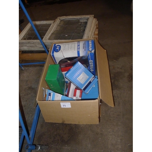 71 - 1 box containing a quantity of various vehicle filters and a set of 4 Estilo wheel trims (14 inch)