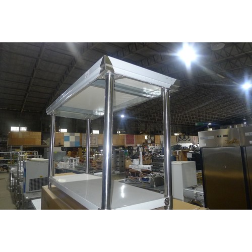 3105 - A commercial stainless steel catering type table with shelf beneath by Diaminox approx 1500x600x900m... 