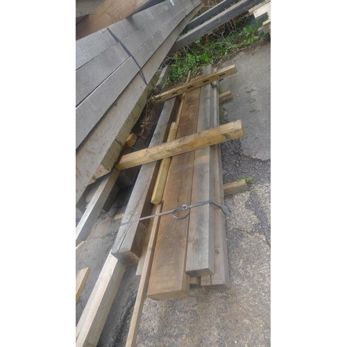 538 - A quantity of various lengths of Oak and other wood including 5 lengths of Oak at 12.5cm x 7.5cm x 3... 