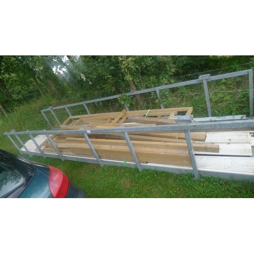 547 - A large galvanised metal stillage approx 500cm w x 123cm d x 74cm high. Please note that the wood in... 