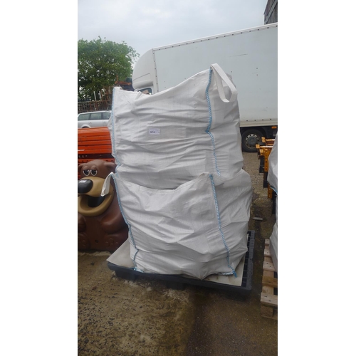 574 - A stack of two dumpy bags both containing wood offcuts