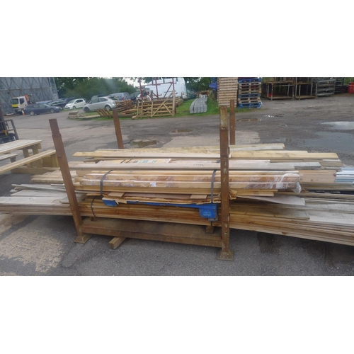 583 - A quantity of various lengths of wood including door lining sets, tongue / groove, other lengths of ... 