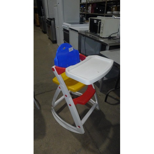 3121 - A childs plastic high chair by Lipski