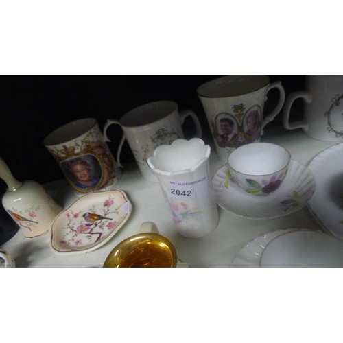 2038 - A large green pottery cat, various brass and copper ornaments, quantity of silver-plated ware, glass... 