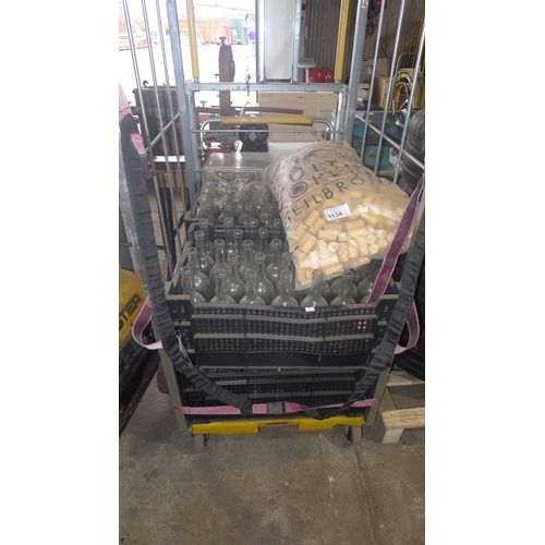 3134 - A quantity of clear glass wine bottles and corks. Contents of 1 wheeled cage which is not included