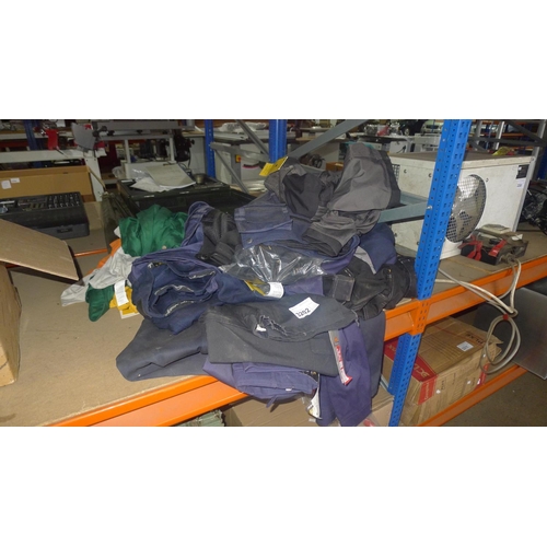 3202 - A quantity of various work clothing by Snickers, Dewalt, Site etc comprising mainly trousers and shi... 