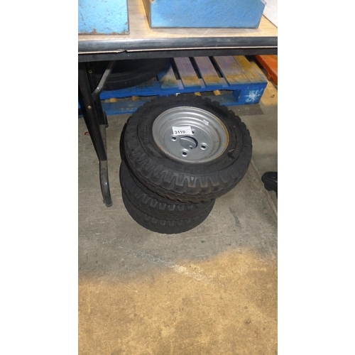 3110 - 4 metal four stud trailer wheel rims each with a Vredestein V54 high speed 4.00-8 tyre fitted