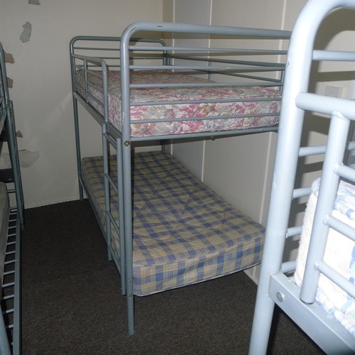 74 - The contents of a student dormitory Room 7A comprising of 14 bunk beds and 5 bays of Dexion type rac... 