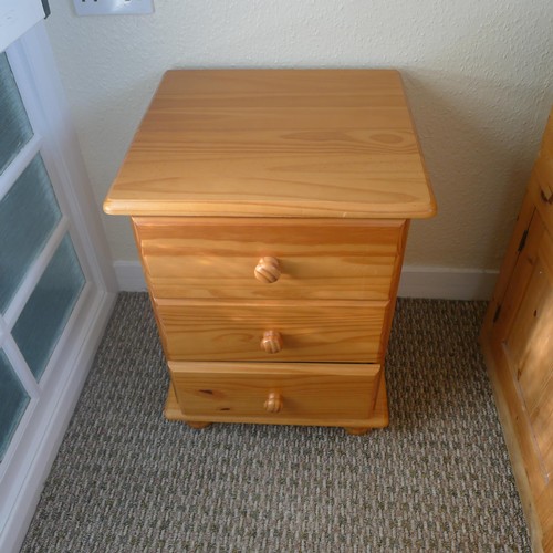 78 - A pine single bed with storage under, a pine bedside cabinet and a mirror - Situated in teacher flat... 