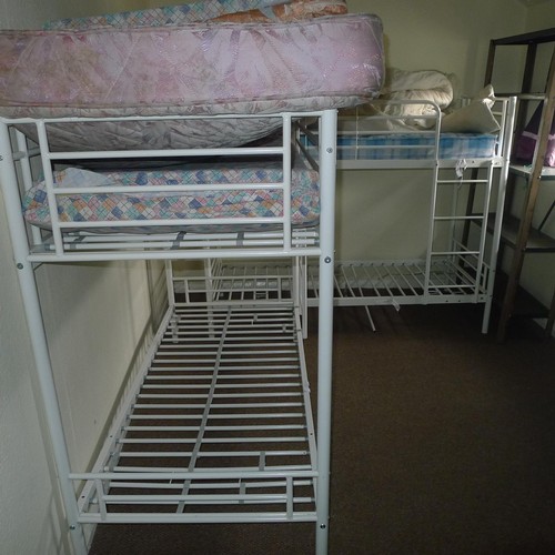 87 - The contents of student dormitory comprising of 8 bunk beds and 4 bays of Dexion type racking - Situ... 