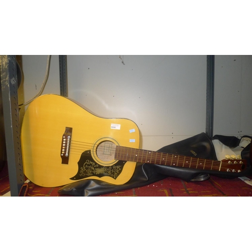 3008 - A six string acoustic guitar with carry bag. marked inside Model No K240