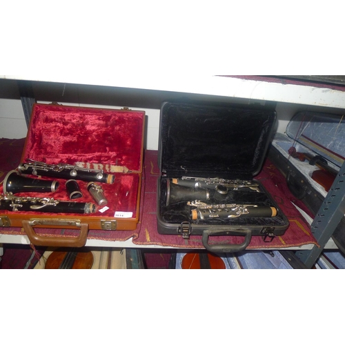 3014 - A clarinet with carry case by Evette-Buffet and a clarinet with carry case by Montreux