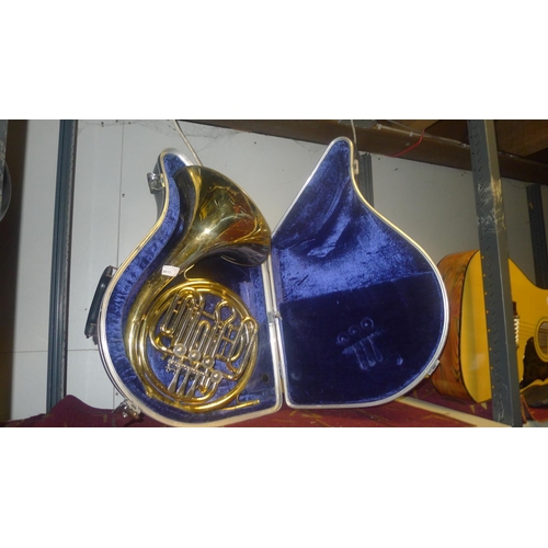 3017 - A brass French horn with carry case by Anbore