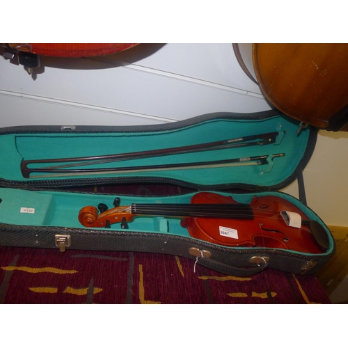 3047 - A half size violin with two bows and carry case