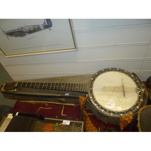 3088 - A vintage four stringed banjo stamped Essex and Cammeyer, with 6 machine heads and carry case