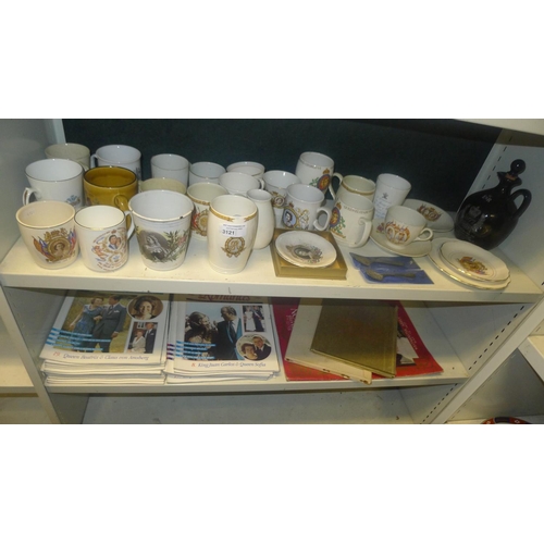 3121 - A quantity of decorative Royal commemoration mugs and similar royal magazines (two shelves)