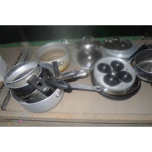 1033 - A quantity of various catering related items including pots, pans etc. Contents of one shelf
