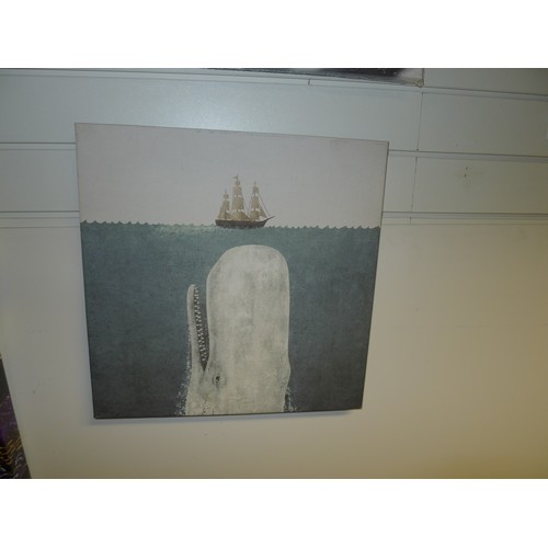 3182 - An unframed canvas of a racing driver, an unframed canvas of a whale and an unframed canvas of a nig... 