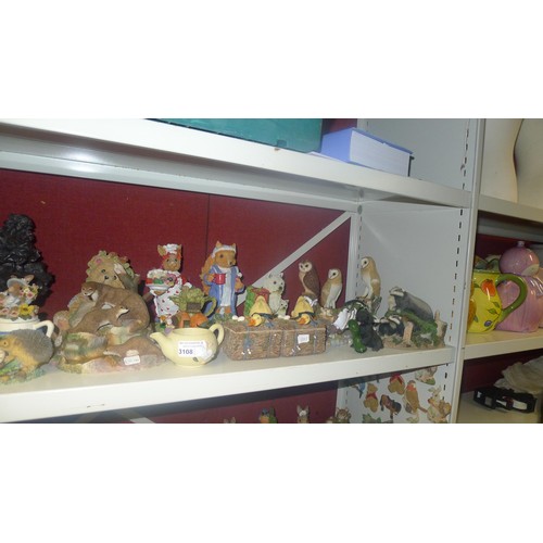 3108 - A large quantity of decorative resin animals and ornaments etc. A quantity of fridge magnets, variou... 