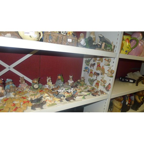 3108 - A large quantity of decorative resin animals and ornaments etc. A quantity of fridge magnets, variou... 