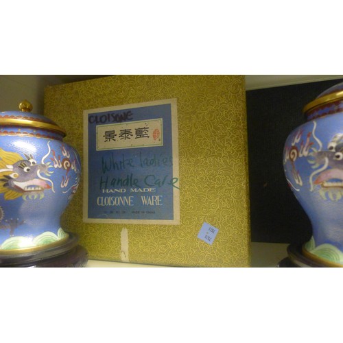 3123 - A pair of blue ground dragon decorated Chinese cloisonne jars with covers and stands