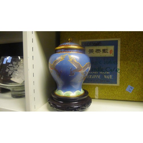 3123 - A pair of blue ground dragon decorated Chinese cloisonne jars with covers and stands