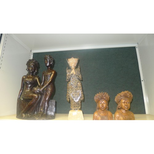 3138 - A quantity of miscellaneous oriental carved hardwood figures (2 shelves)