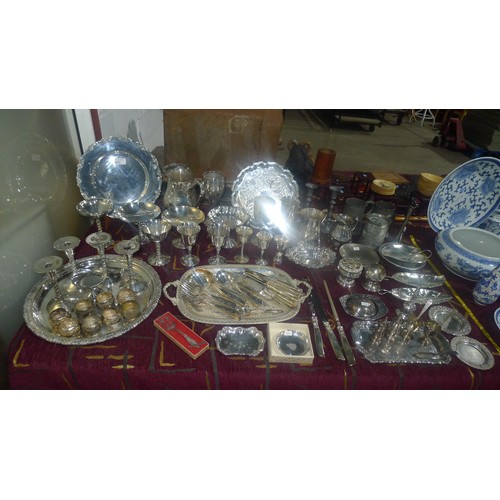 3310 - A large quantity of miscellaneous decorative silver-plated ware, cutlery and other metalware etc