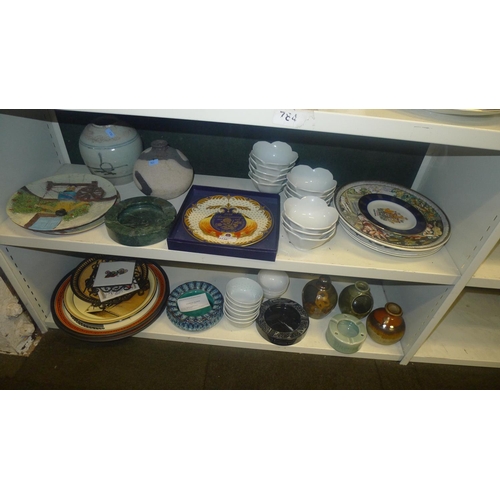 3130 - A quantity of miscellaneous decorative wall plates small vases and other ornaments etc (two shelves)