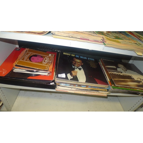 3166 - A quantity of miscellaneous LP records and singles (one shelf)