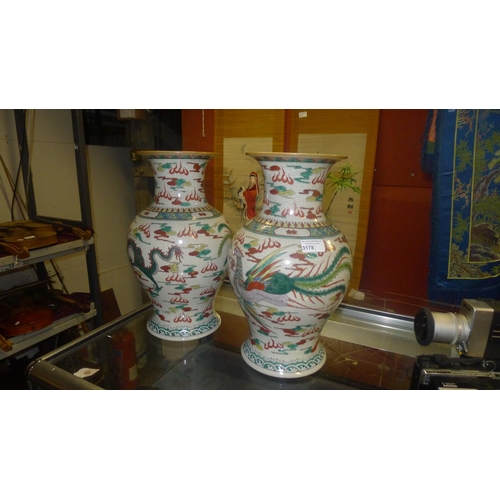 3178 - A pair of multi-coloured Chinese bird and floral decorated bulbous vases, good condition.