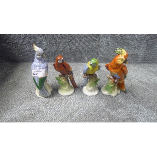 3238 - A set of four decorative figures of parrots