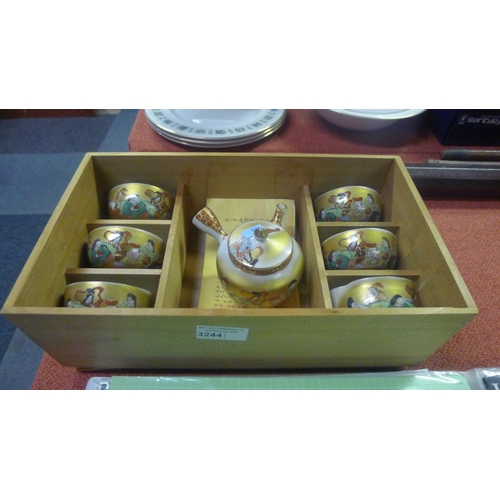 3244 - A boxed set of decorative Japanese tea bowls with teapot