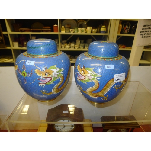 3261 - A pair of blue ground dragon decorated Chinese cloisonne jars with lids