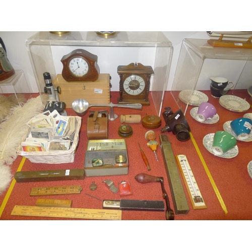 3262 - A small microscope with box, 2 wooden cased mantel clocks a weighing spoon, a vintage spirit level a... 