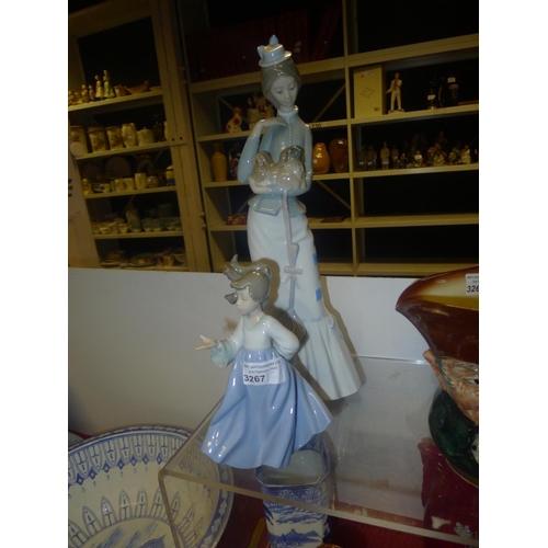 3267 - A tall Lladro figure of a lady with dog and a small Nao figure of a girl