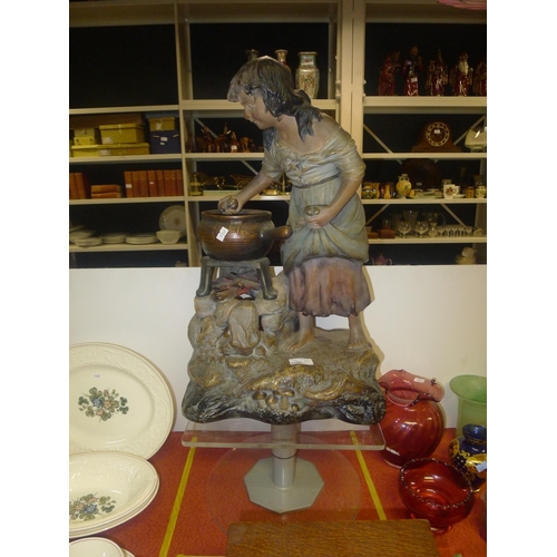 3280 - A large coloured spelter figure of a girl at a cooking pot approximately 56 cm tall