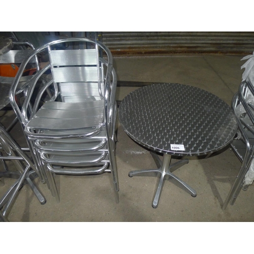 1006 - A metal bistro table and 4 matching stacking chairs