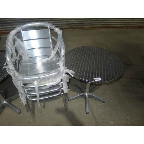 1007 - A metal bistro table and 4 matching stacking chairs