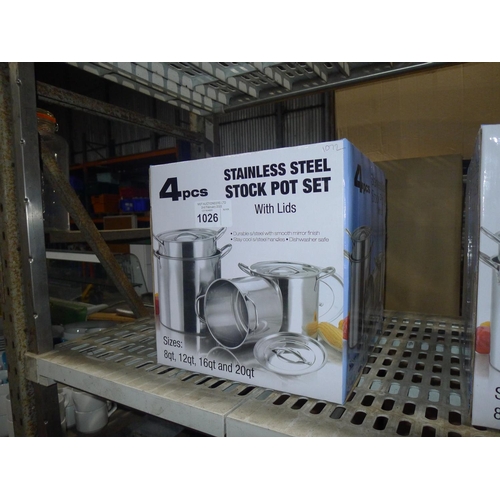 1026 - A 4 piece stainless steel stock pot set with lids