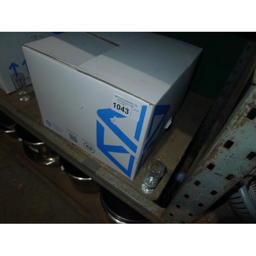 1043 - A box containing a quantity of various shot glasses