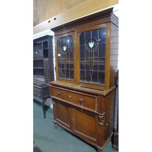 3358 - A Victorian stained secretaire bookcase with two leaded glazed doors above enclosing adjustable shel... 