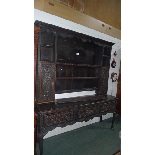 3361 - A heavily carved oak dresser approx 186cm wide x 218cm high