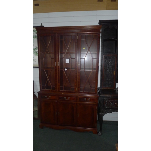 3362 - A reproduction mahogany bookcase cabinet with three astral glazed doors enclosing shelves, drawers a... 