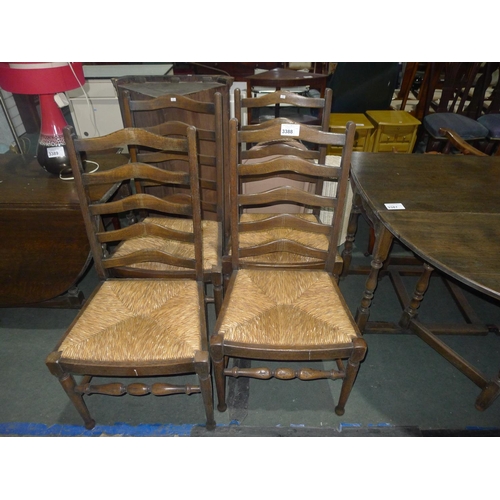 3388 - A set of 4 vintage dark Oak dining chairs with rush seats