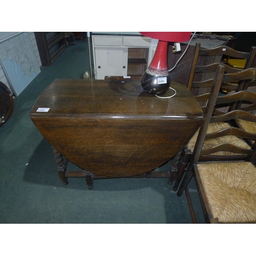 3390 - A vintage dark Oak gate leg table