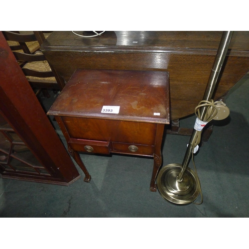 3393 - A reproduction dark mahogany sewing box with a lift lid and drawers under