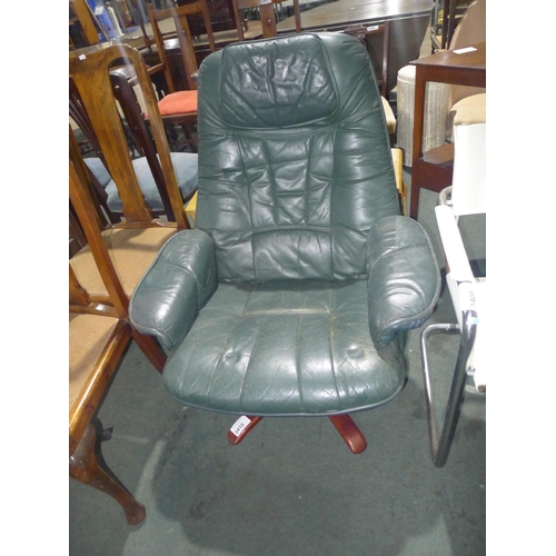 3410 - A vintage green leather upholstered a swivel armchair